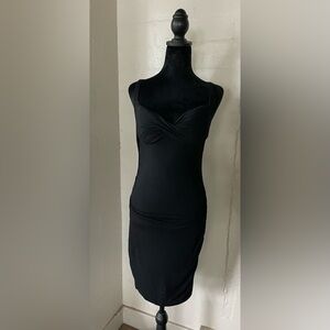 Bodycon bebe dress Y2K with cross back style and built in push-up bra size S